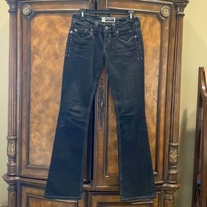 MEK black denim boot cut jeans.